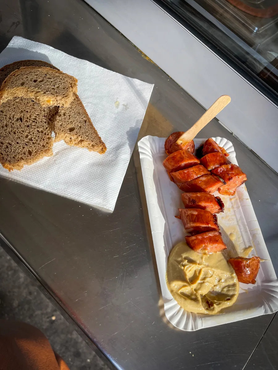 sausage cut into rounds served with mustard and brown bread.