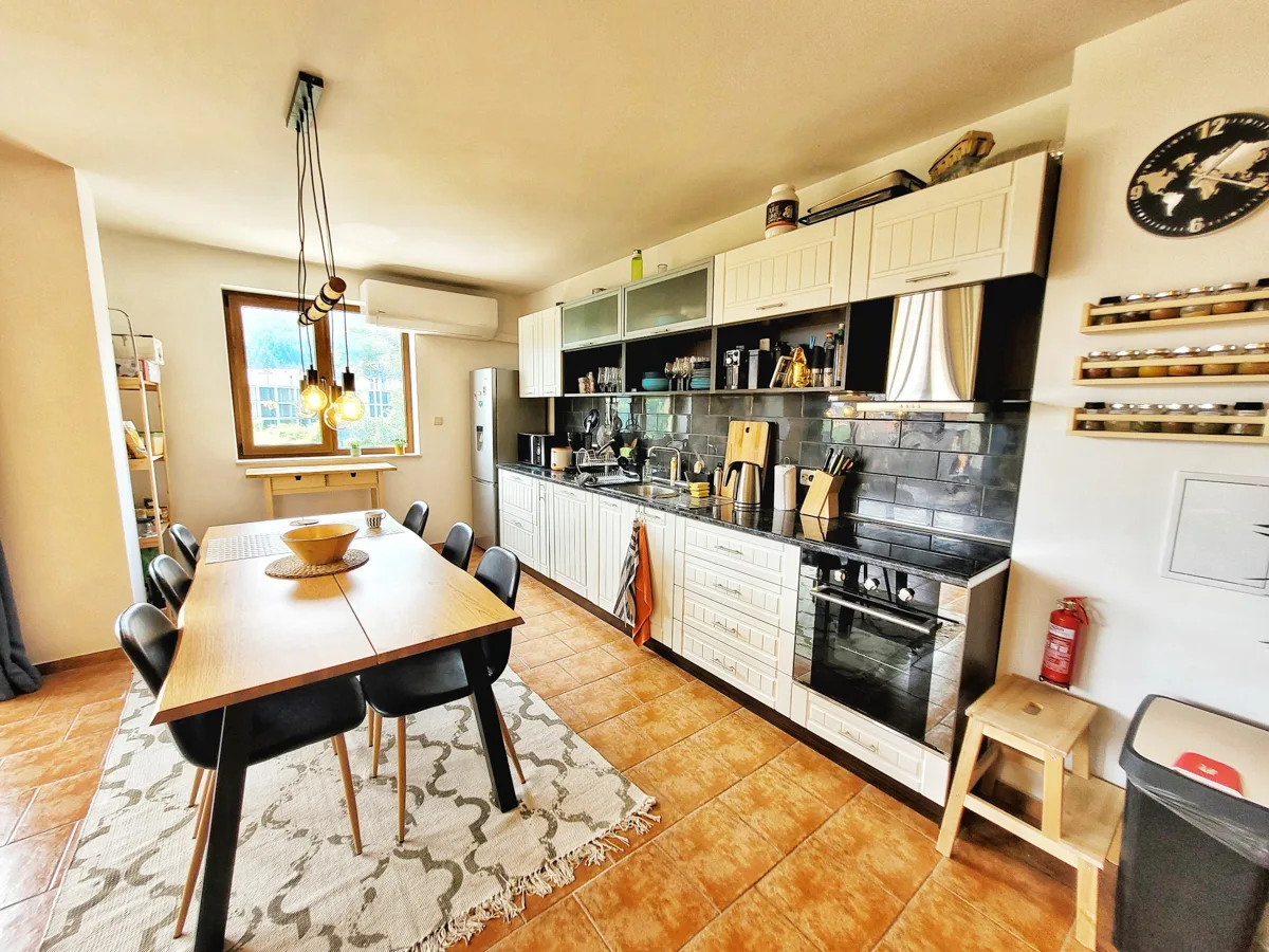 kitchen and dining table inside an apartment.