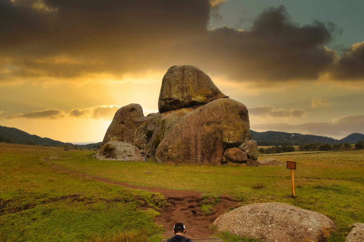 large rocks with the sun setting behind them at one of the pueblos magicos in Jalisco.