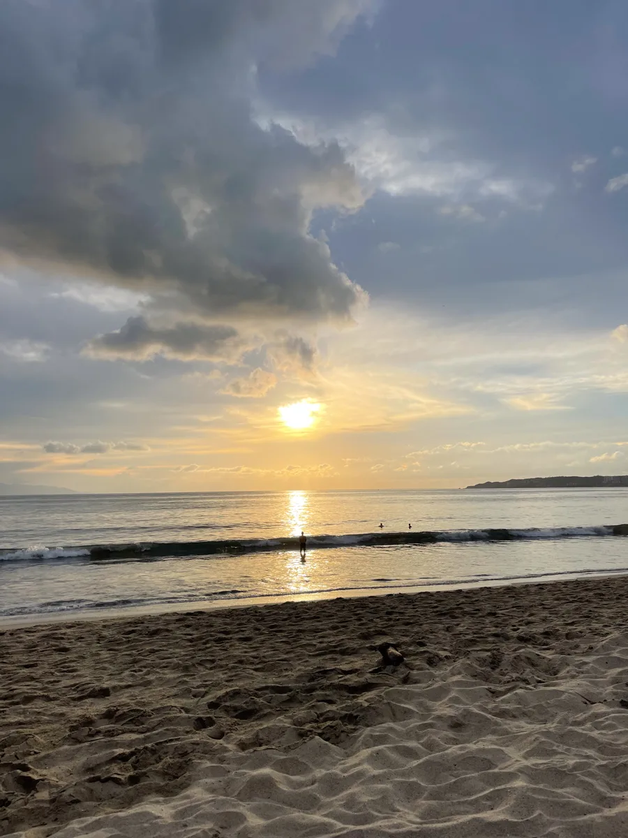 sun setting over the ocean.