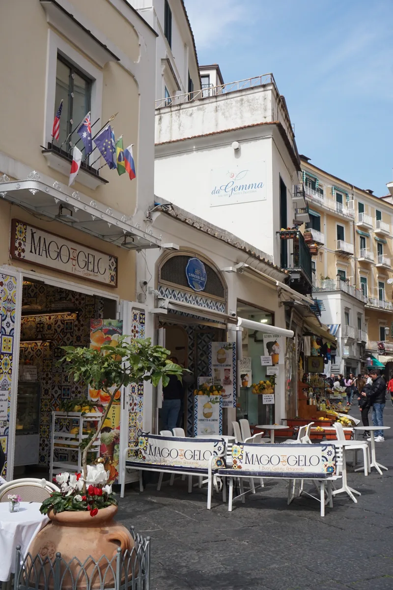 Amalfi town with shops along the main street.