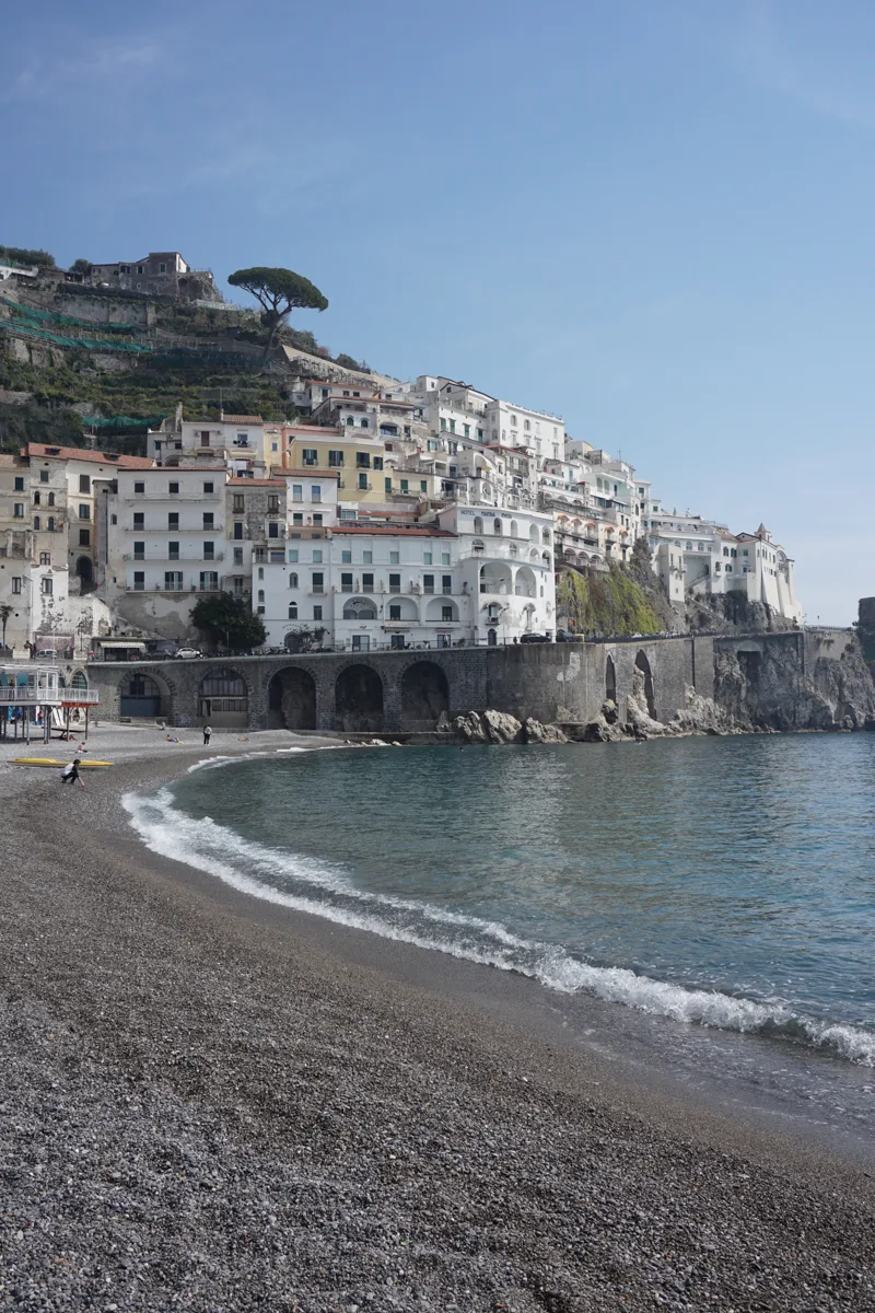 amalfi coast with white buildings lining the hills.