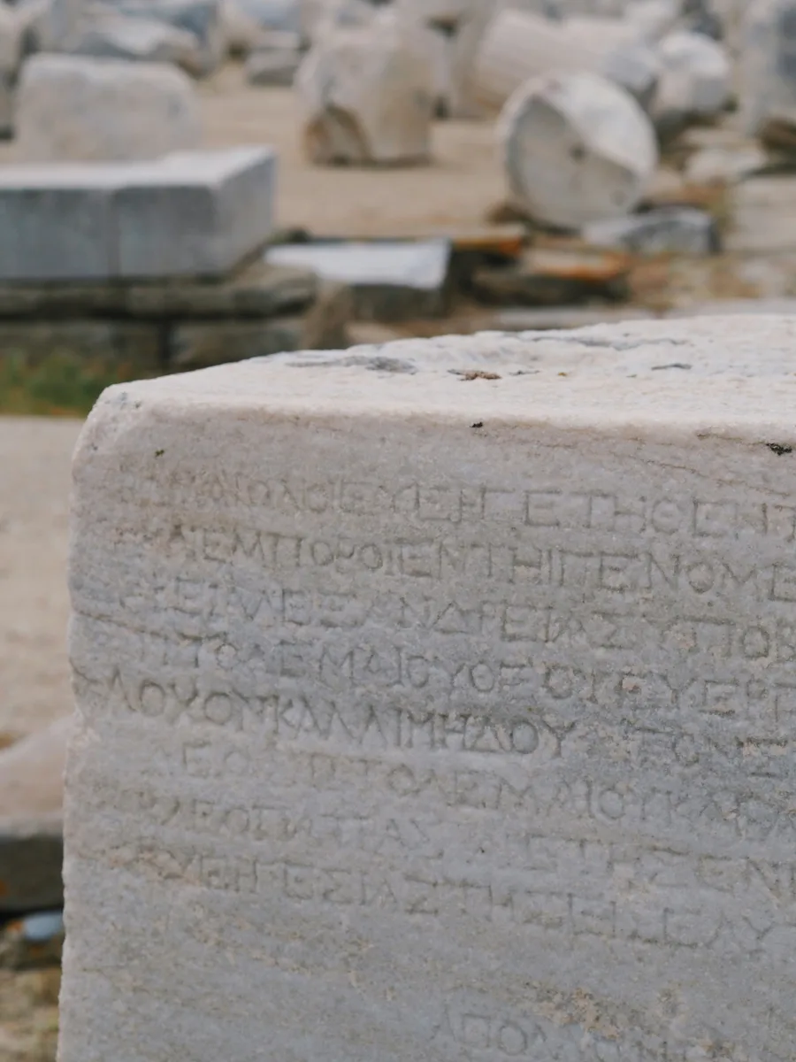 words inscribed into stone in Greek letters.