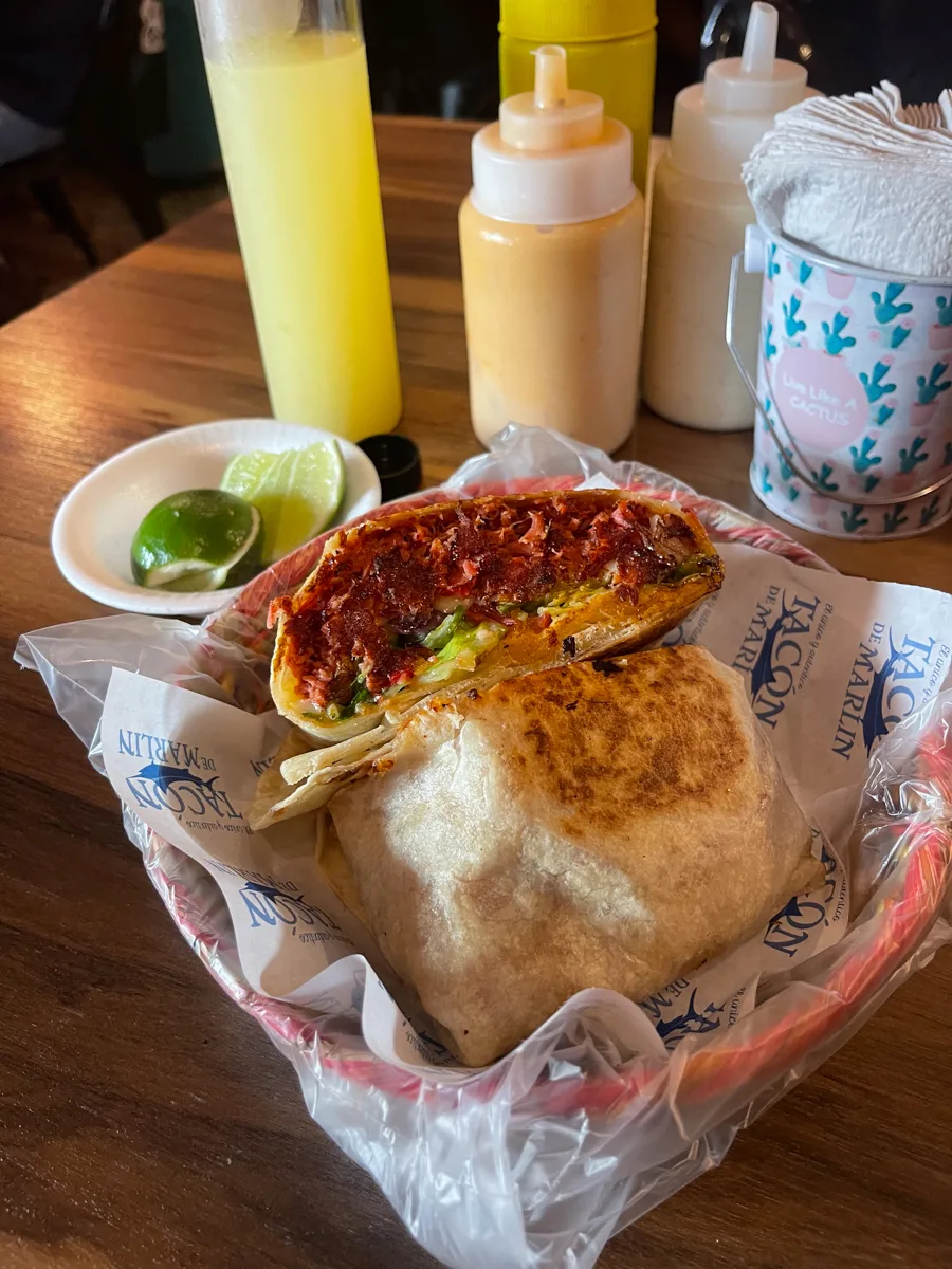 marlin burrito with sauces in the background.