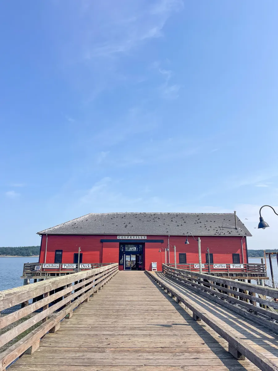 red building at the end of a pier in Coupeville, washington, a small town in Whidbey Island.