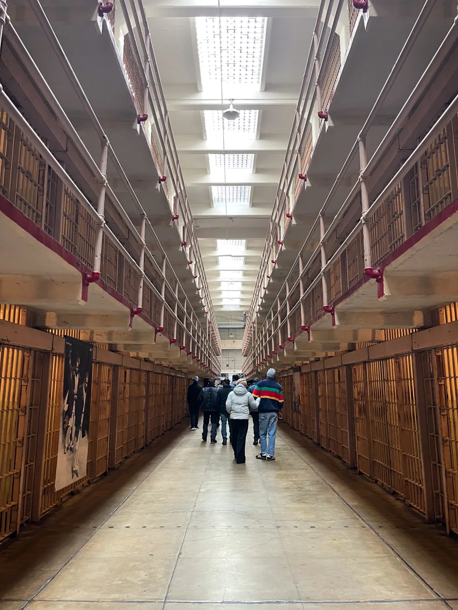 the inside of Alcatraz looking down the hallways of all of the cells.